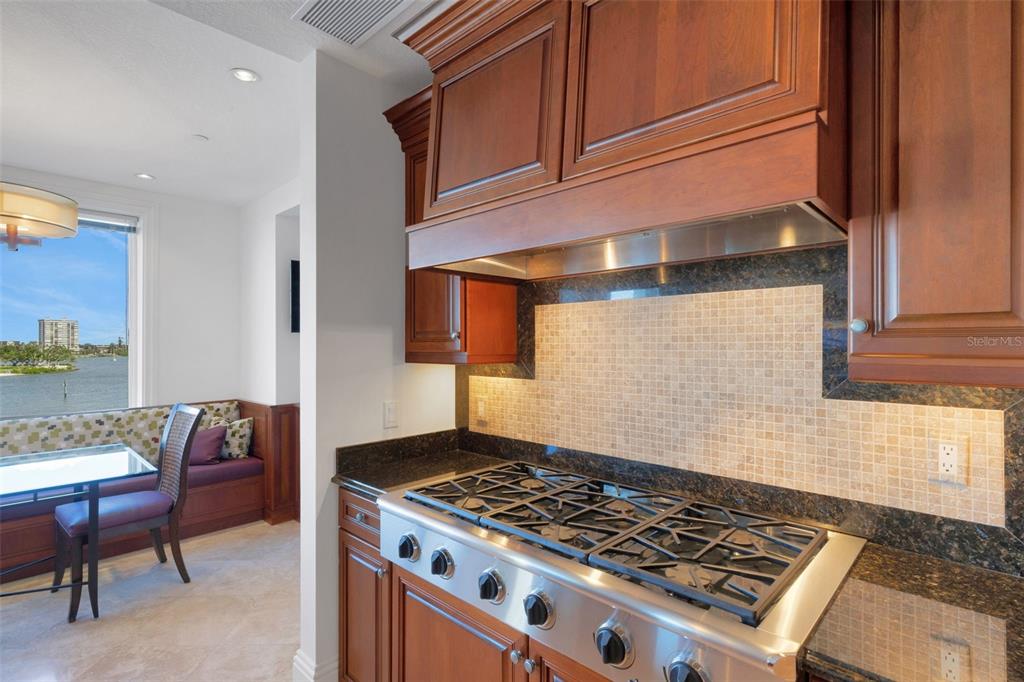 464 Golden Gate Point, Unit 403 Sarasota, FL 34236 - Photo 36 of 95 a stove top oven sitting inside of a kitchen