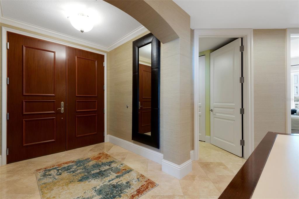 464 Golden Gate Point, Unit 403 Sarasota, FL 34236 - Photo 39 of 95 a view of a hallway with closet and bathroom