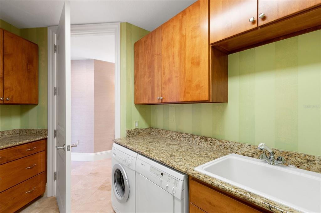 464 Golden Gate Point, Unit 403 Sarasota, FL 34236 - Photo 40 of 95 a bathroom with a granite countertop sink and a mirror