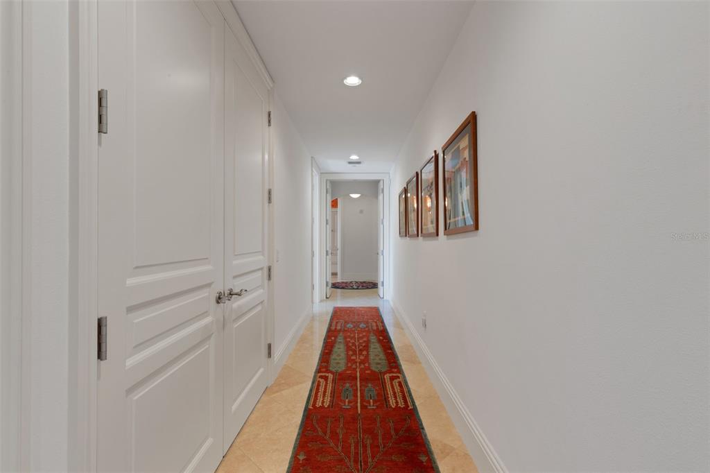 464 Golden Gate Point, Unit 403 Sarasota, FL 34236 - Photo 41 of 95 a view of a hallway with wooden floor and staircase