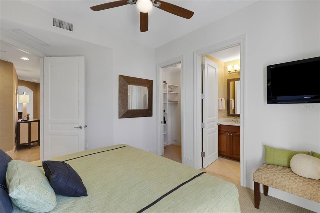 464 Golden Gate Point, Unit 403 Sarasota, FL 34236 - Photo 45 of 95 a bedroom with a bed and a flat screen tv