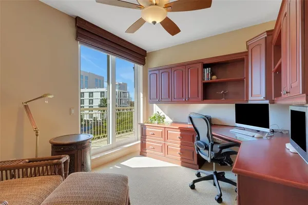 a dining room with furniture and a flat screen tv