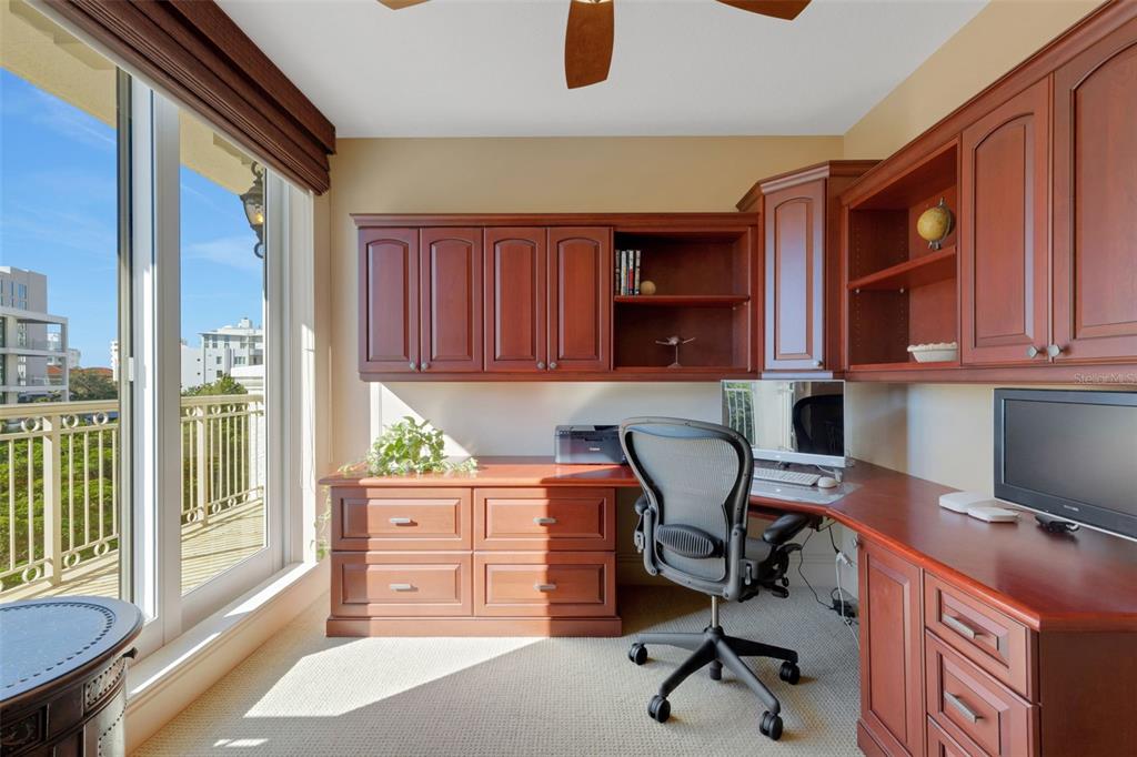 464 Golden Gate Point, Unit 403 Sarasota, FL 34236 - Photo 48 of 95 a view of a workspace with furniture and a window