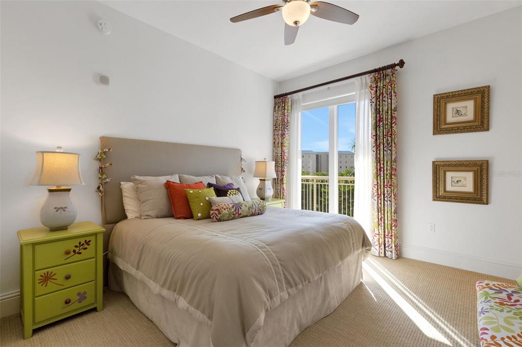 464 Golden Gate Point, Unit 403 Sarasota, FL 34236 - Photo 50 of 95 a bedroom with a bed and a window