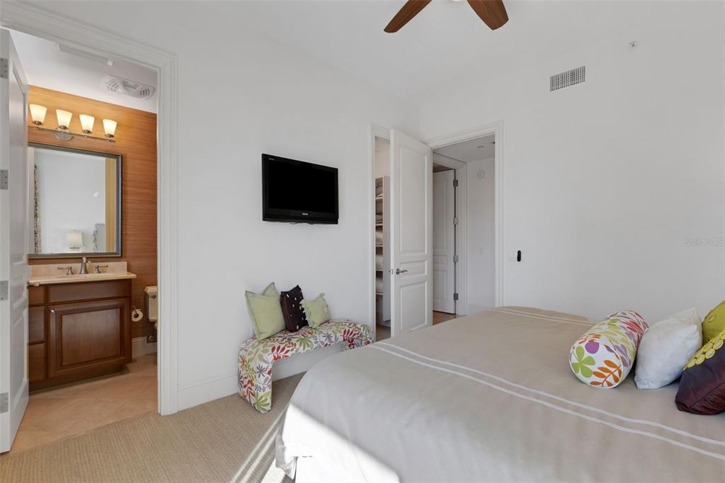 464 Golden Gate Point, Unit 403 Sarasota, FL 34236 - Photo 52 of 95 a bedroom with a bed and a television