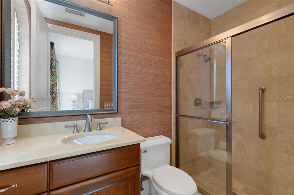 464 Golden Gate Point, Unit 403 Sarasota, FL 34236 - Photo 53 of 95 a bathroom with a sink toilet and shower