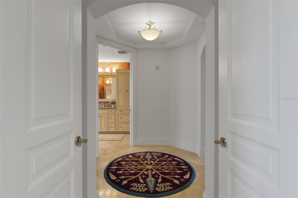 464 Golden Gate Point, Unit 403 Sarasota, FL 34236 - Photo 54 of 95 a bathroom with a sink and a mirror
