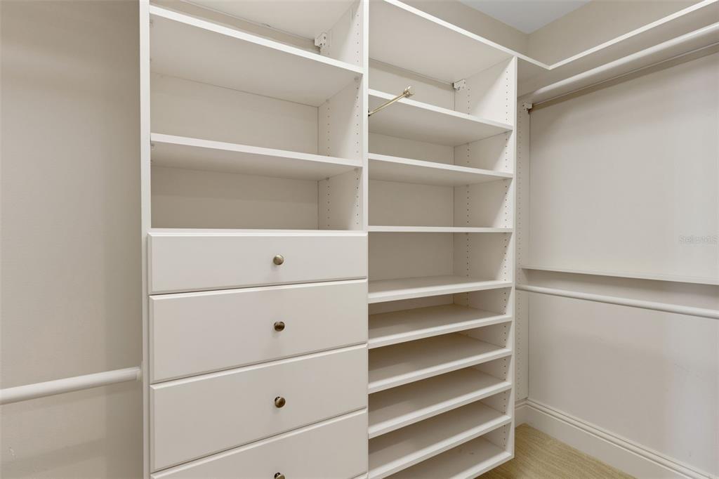 464 Golden Gate Point, Unit 403 Sarasota, FL 34236 - Photo 60 of 95 a view of walk in closet with empty racks