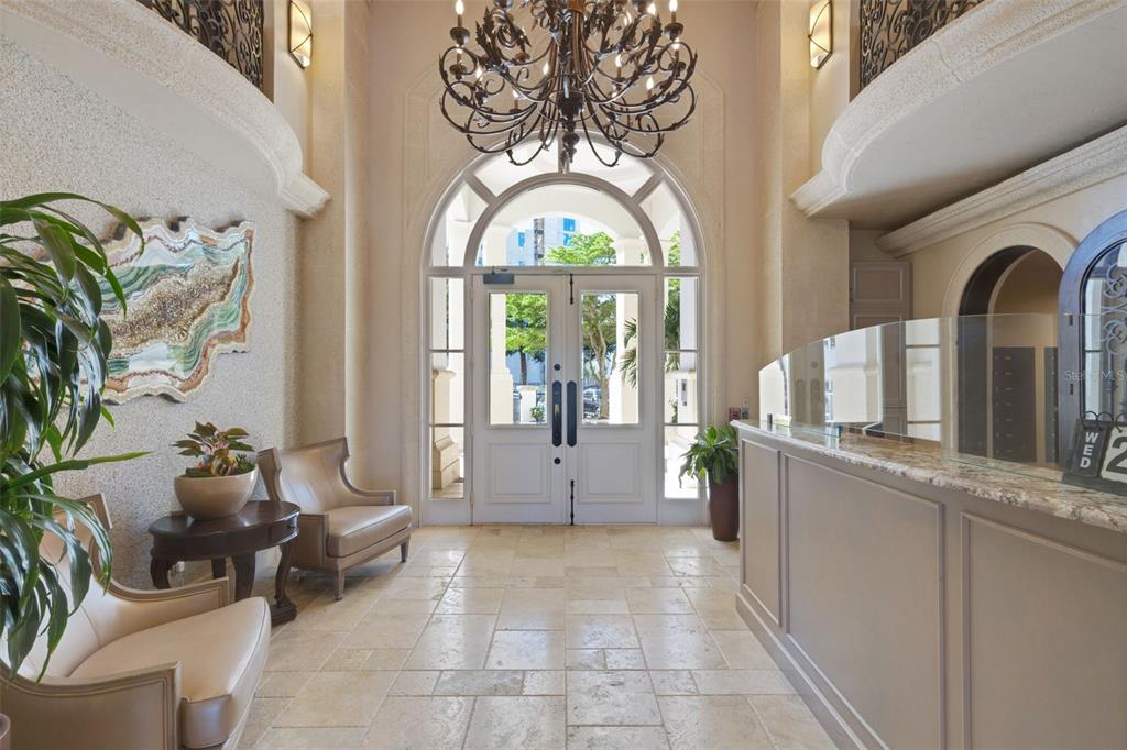 464 Golden Gate Point, Unit 403 Sarasota, FL 34236 - Photo 6 of 95 a living room with furniture and a large window