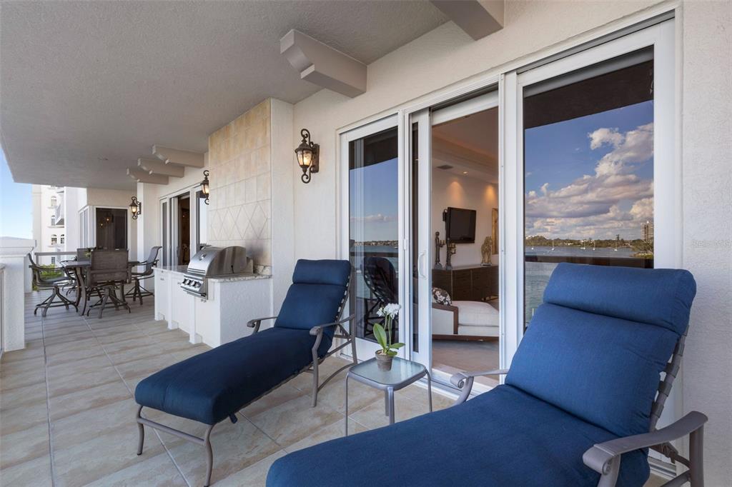 464 Golden Gate Point, Unit 403 Sarasota, FL 34236 - Photo 69 of 95 a living room with furniture and a large window