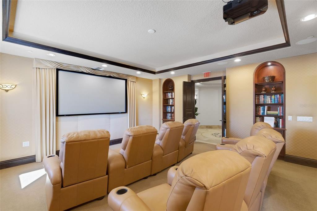 464 Golden Gate Point, Unit 403 Sarasota, FL 34236 - Photo 90 of 95 a living room with furniture and a flat screen tv