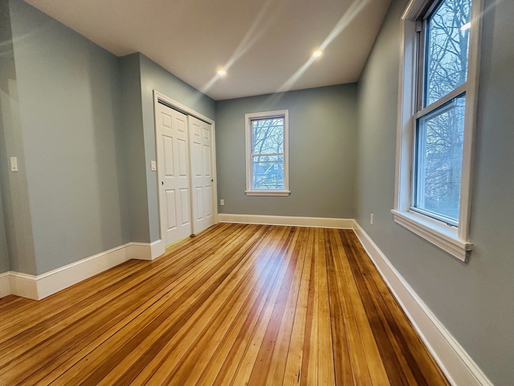 28 Melbourne Street, Unit 2 Boston, MA 02124 - Photo 17 of 27 a view of a room with wooden floor and windows