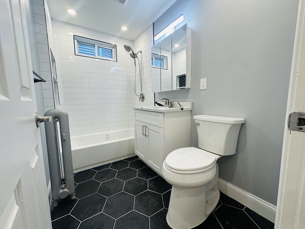 28 Melbourne Street, Unit 2 Boston, MA 02124 - Photo 18 of 27 a bathroom with a toilet and a shower