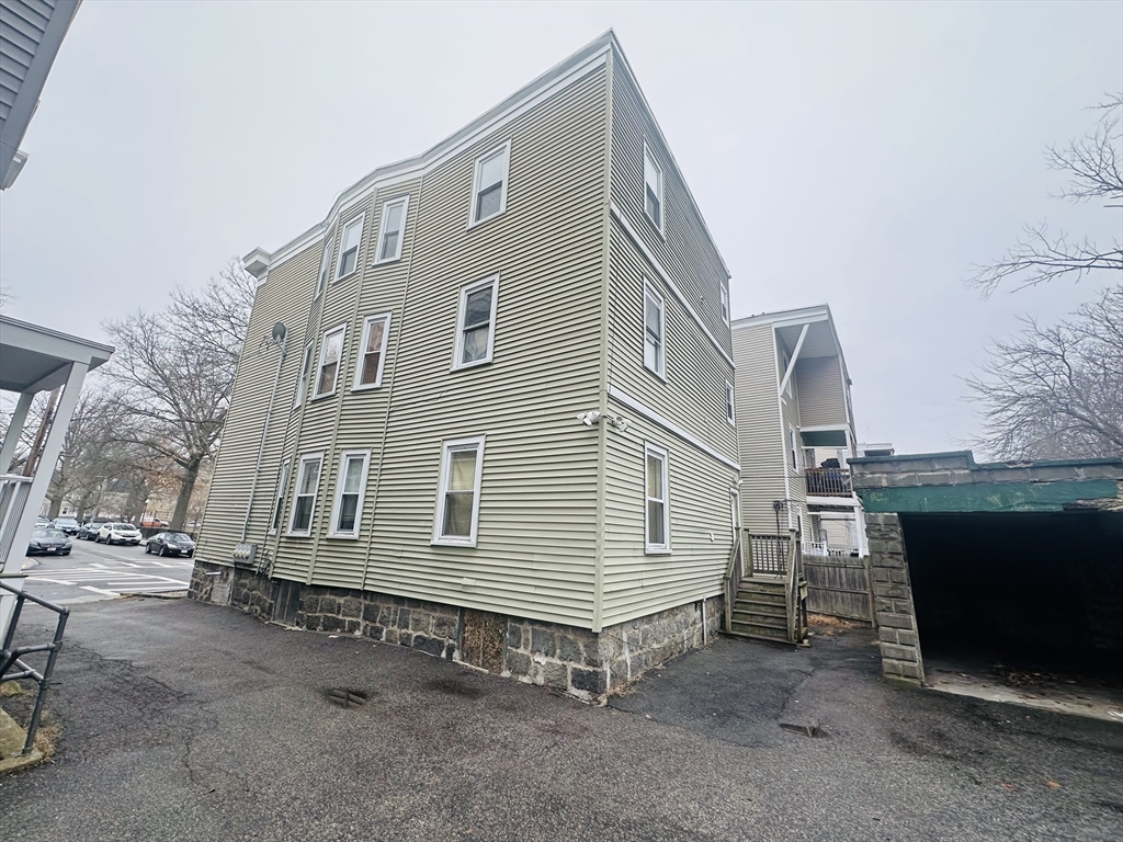 28 Melbourne Street, Unit 2 Boston, MA 02124 - Photo 2 of 27 a front view of a house with a yard