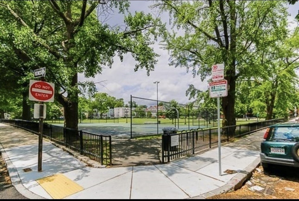 28 Melbourne Street, Unit 2 Boston, MA 02124 - Photo 3 of 27 a view of a park with iron fence