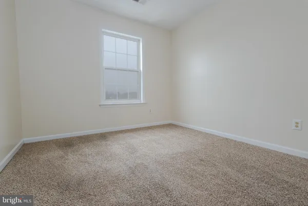 a bathroom with a toilet sink and shower