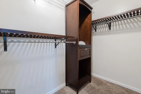 a view of an entryway with a hallway