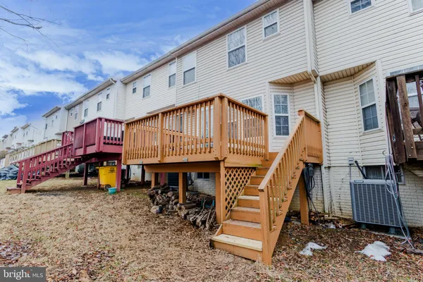 a view of a house with a roof deck and a chair