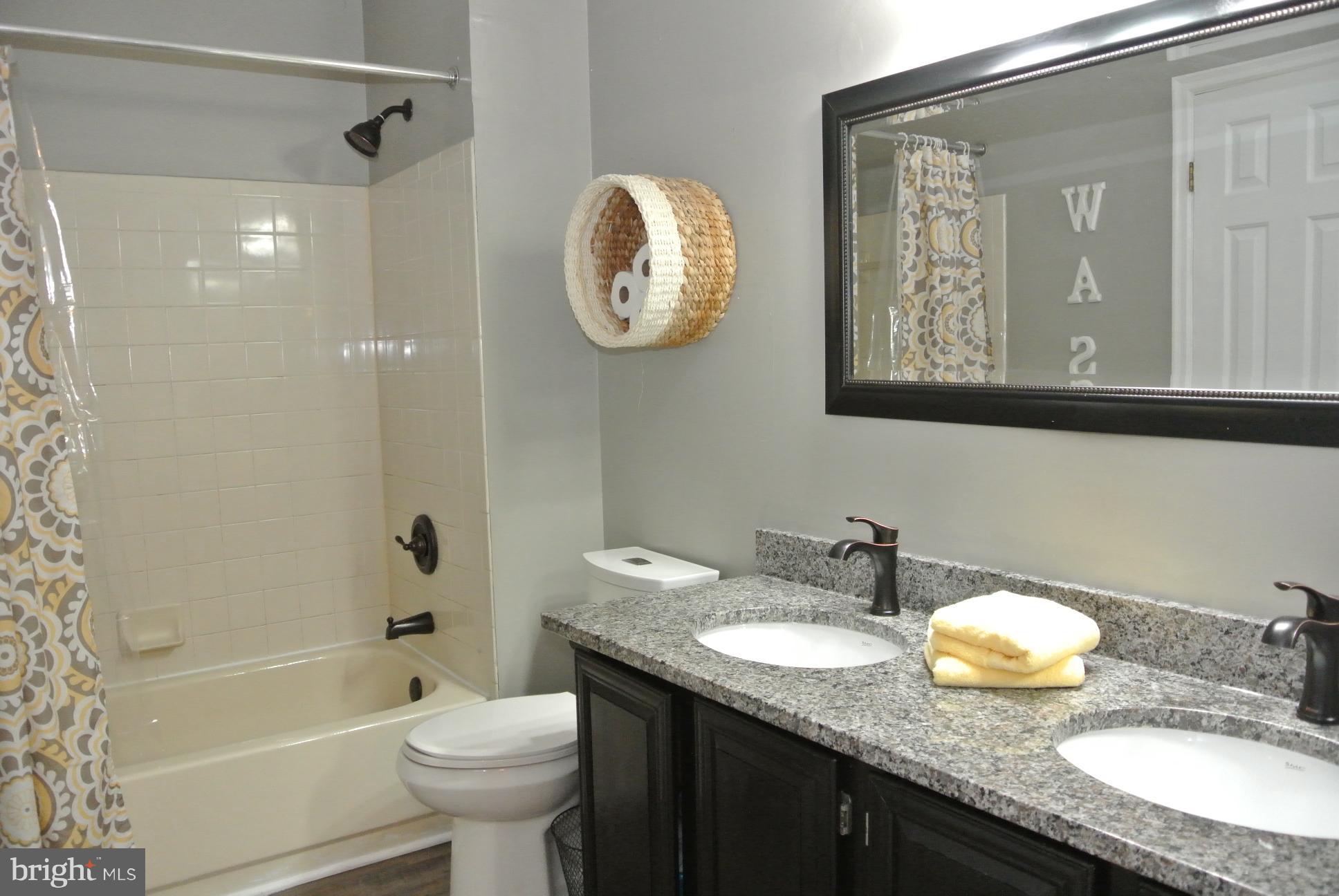 8729 Silver Hall Road Perry Hall, MD 21128 - Photo 11 of 30 Bathroom in hallway with access to master bedroom