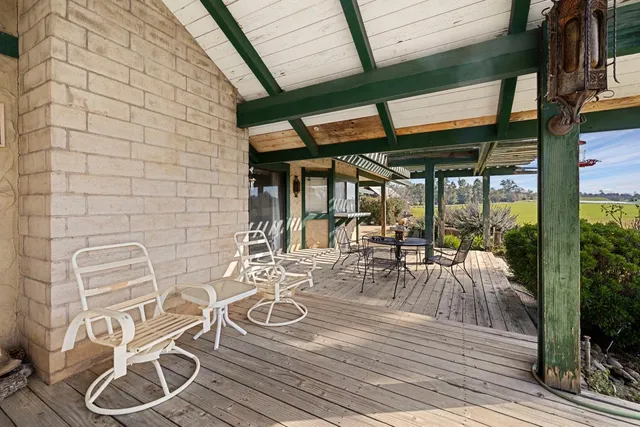 a view of swimming pool with outdoor seating