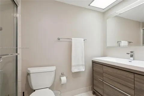 a bathroom with a sink toilet and vanity