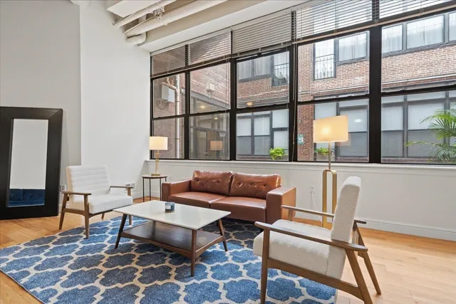 a living room with furniture and a window
