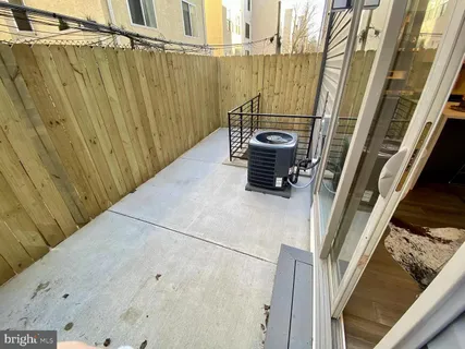 a view of a balcony with car parked