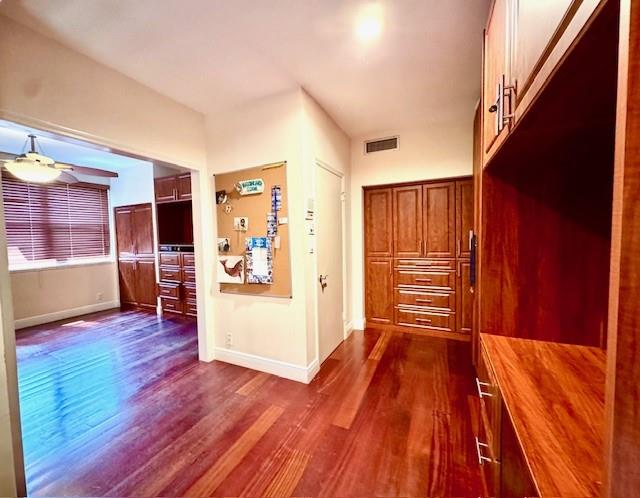 1540 Northeast Quayside Terrace, Unit D1 Miami, FL 33138 - Photo 15 of 45 a view of an empty room with wooden floor and a window