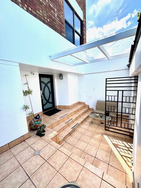 1540 Northeast Quayside Terrace, Unit D1 Miami, FL 33138 - Photo 2 of 45 a bedroom with a bed and a table