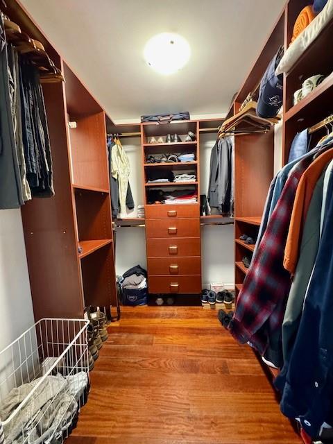1540 Northeast Quayside Terrace, Unit D1 Miami, FL 33138 - Photo 25 of 45 a view of walk in closet with clothes and shoes