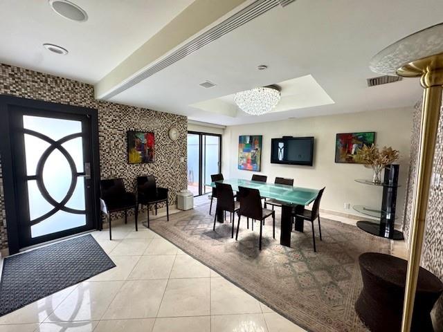 1540 Northeast Quayside Terrace, Unit D1 Miami, FL 33138 - Photo 3 of 45 a view of a dining room with furniture window and wooden floor