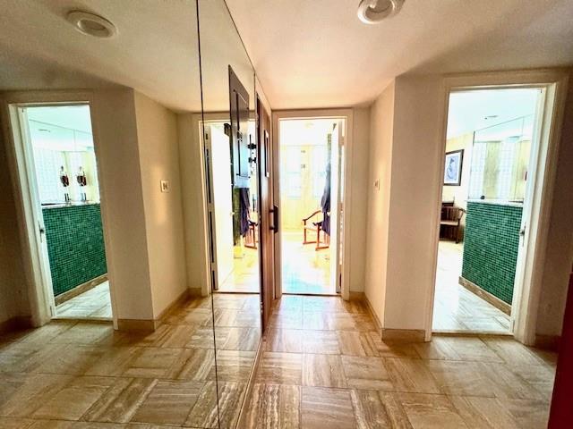 1540 Northeast Quayside Terrace, Unit D1 Miami, FL 33138 - Photo 32 of 45 a view of a bathroom with a shower and a sink