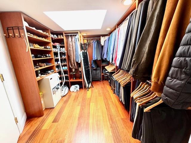 1540 Northeast Quayside Terrace, Unit D1 Miami, FL 33138 - Photo 40 of 45 a view of walk in closet with clothes and shoes
