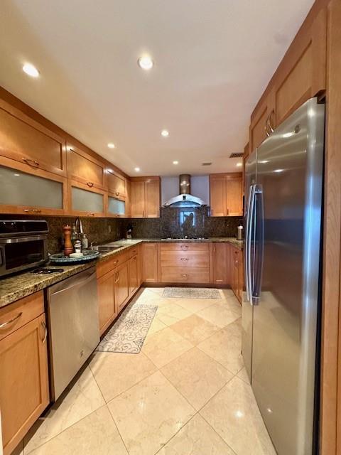 1540 Northeast Quayside Terrace, Unit D1 Miami, FL 33138 - Photo 5 of 45 a large kitchen with stainless steel appliances kitchen island granite countertop a refrigerator and a sink