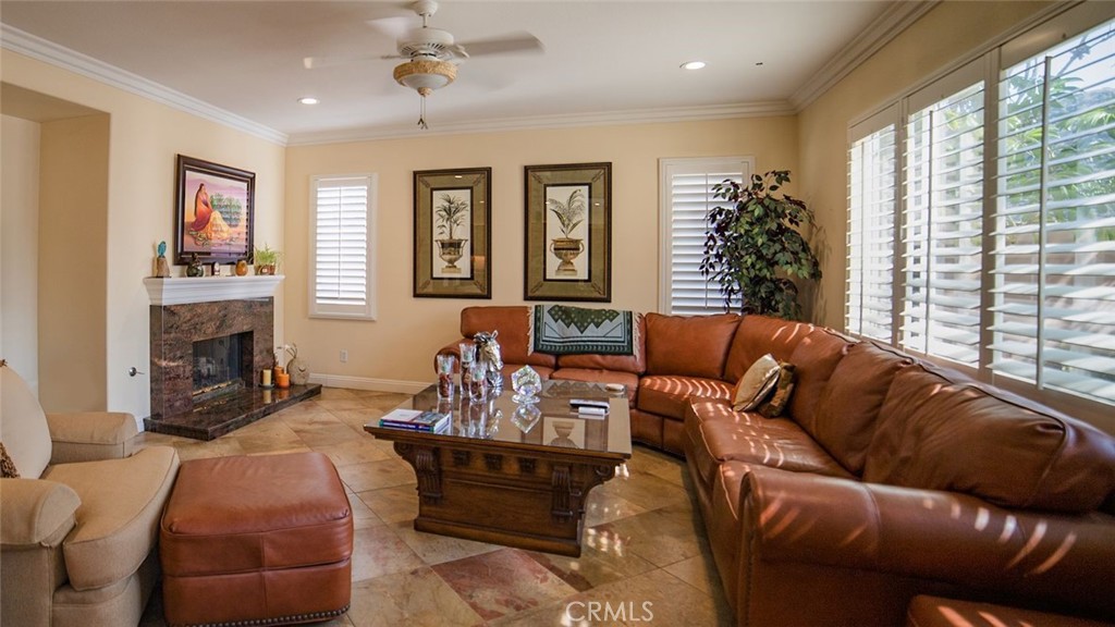 27 Mountain Laurel Way Azusa, CA 91702 - Photo 12 of 39 a living room with furniture fireplace and a large window
