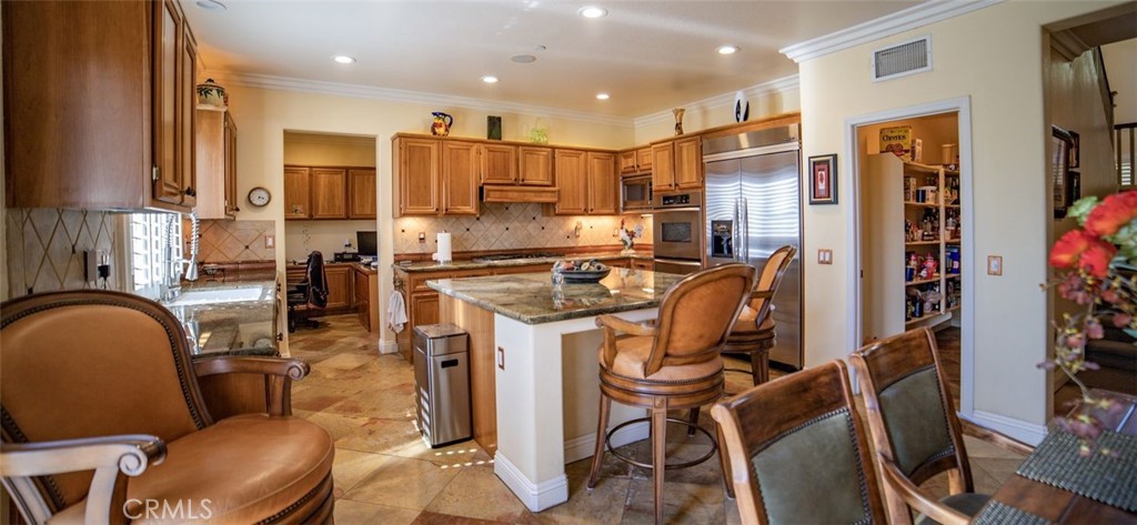 27 Mountain Laurel Way Azusa, CA 91702 - Photo 14 of 39 a kitchen with furniture a refrigerator and a view of living room