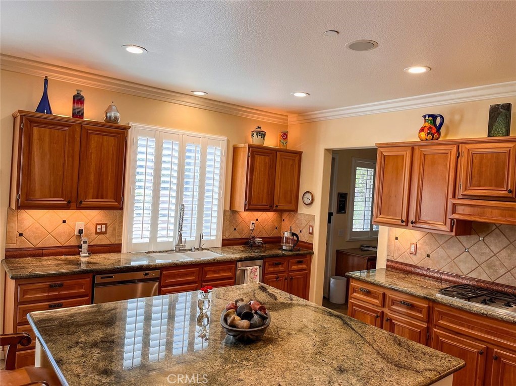 27 Mountain Laurel Way Azusa, CA 91702 - Photo 17 of 39 a kitchen that has a lot of cabinets in it