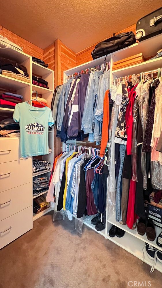 27 Mountain Laurel Way Azusa, CA 91702 - Photo 32 of 39 a view of walk in closet with clothes and shoes