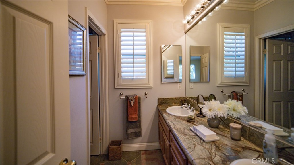 27 Mountain Laurel Way Azusa, CA 91702 - Photo 33 of 39 a close view of sink and mirror