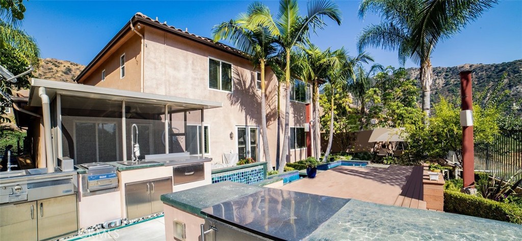 27 Mountain Laurel Way Azusa, CA 91702 - Photo 36 of 39 front view of house with a yard and potted plants