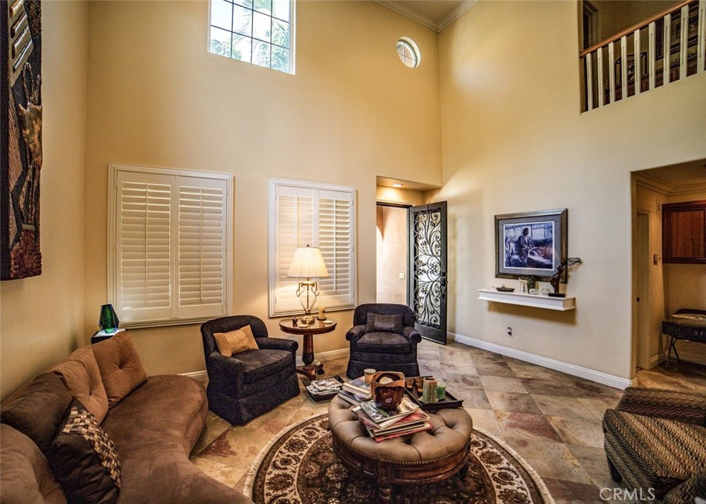 27 Mountain Laurel Way Azusa, CA 91702 - Photo 4 of 39 a living room with furniture and a flat screen tv