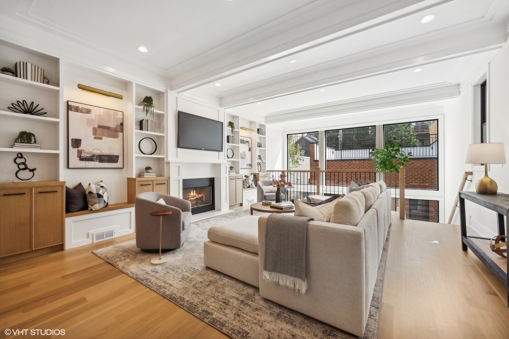 1413 North Mohawk Street Chicago, IL 60610 - Photo 14 of 51 a living room with furniture a fireplace and a flat screen tv