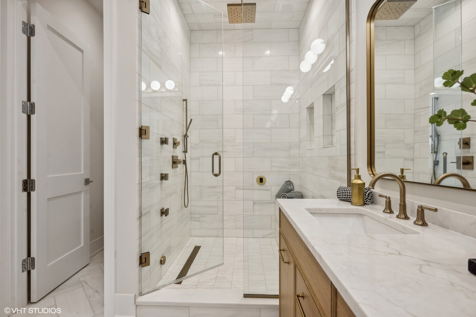 1413 North Mohawk Street Chicago, IL 60610 - Photo 28 of 51 a bathroom with double vanity and a shower
