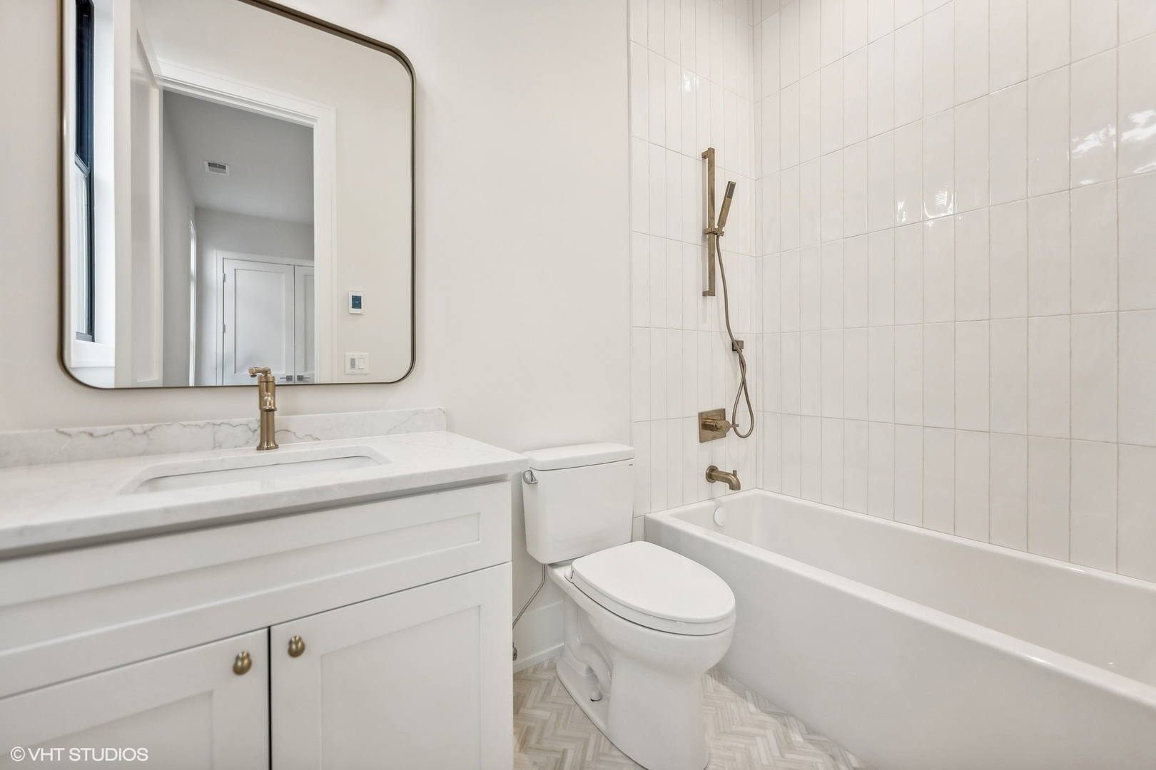 1413 North Mohawk Street Chicago, IL 60610 - Photo 30 of 51 a bathroom with a granite countertop sink a toilet and a bathtub