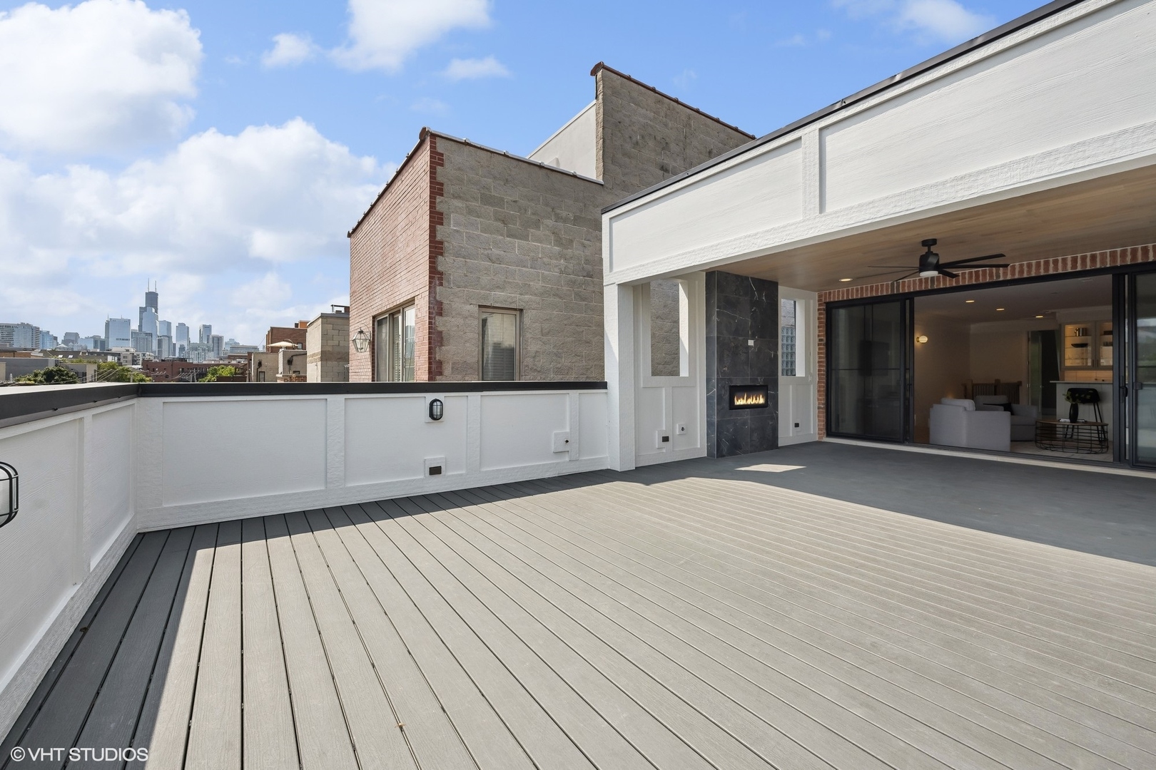 1413 North Mohawk Street Chicago, IL 60610 - Photo 37 of 51 a view of a terrace with wooden floor and a ceiling fan