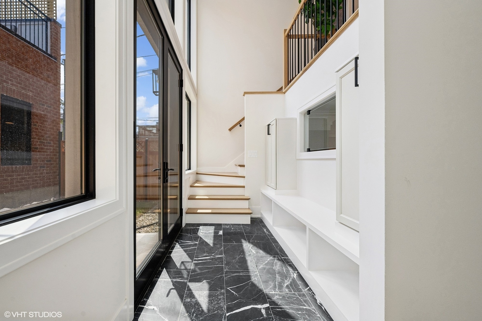 1413 North Mohawk Street Chicago, IL 60610 - Photo 42 of 51 a view of a hallway with wooden floor and staircase