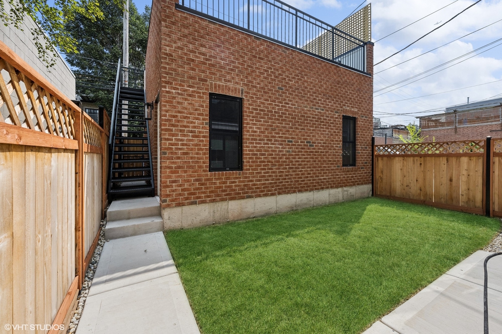 1413 North Mohawk Street Chicago, IL 60610 - Photo 49 of 51 a front view of a house with a yard