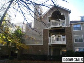 5003 Sharon Road, Unit H Charlotte, NC 28210 - Photo 1 of 8 a front view of a house with parking space
