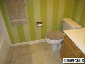5003 Sharon Road, Unit H Charlotte, NC 28210 - Photo 6 of 8 a bathroom with a sink and a toilet