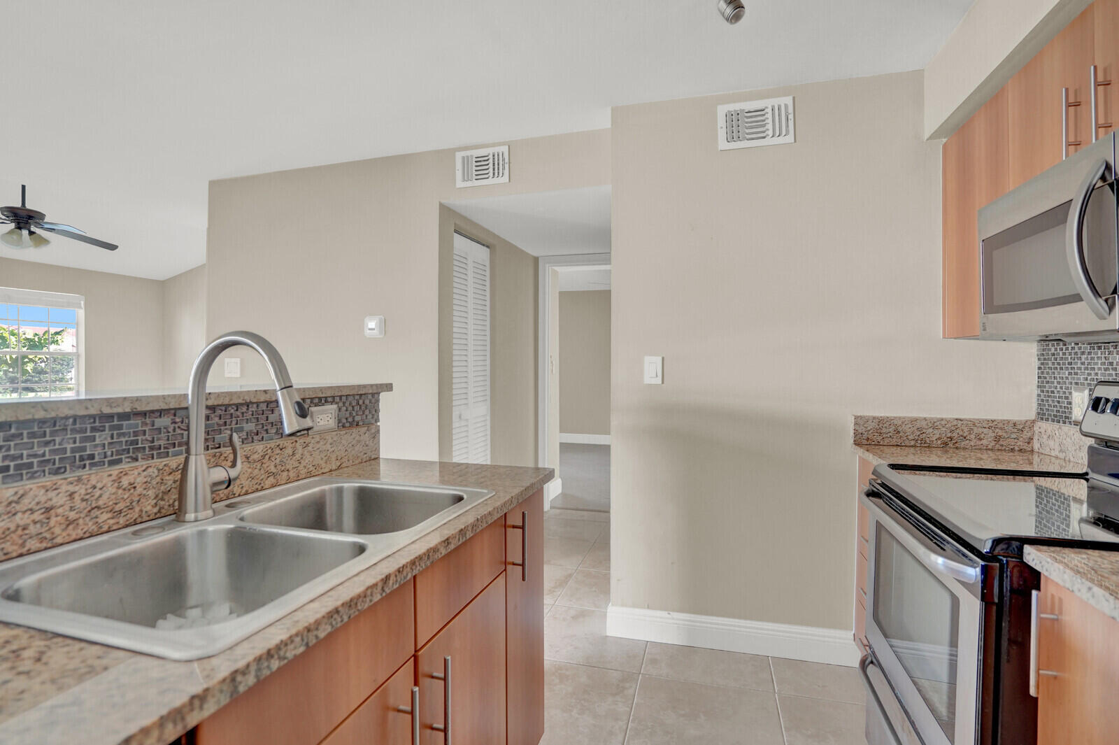 1215 Crystal Way, Unit N Delray Beach, FL 33444 - Photo 14 of 29 a close view of a sink and tap